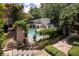 Beautiful pool area surrounded by lush greenery and decorative brickwork at this multi-Gathering property at 2232 Dunseath Ave # 407, Atlanta, GA 30318