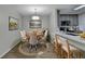 Cozy dining area adjacent to the kitchen with a round table and seating for six, perfect for meals at 3650 Ashford Dunwoody Rd, Ne, #923, Atlanta, GA 30319