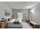 Staged main bedroom with ample natural light, neutral color palette, and stylish decor at 3650 Ashford Dunwoody Rd, Ne, #923, Atlanta, GA 30319