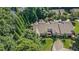 Overhead shot of homes surrounded by mature trees, green lawns, and landscaped gardens at 3802 Abbott Ln # 14, Powder Springs, GA 30127