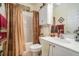Cozy bathroom with a shower/tub combo, decorative curtains, and white vanity at 3802 Abbott Ln # 14, Powder Springs, GA 30127