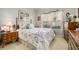 Charming bedroom with a floral bedding, bright window, and traditional furnishings at 3802 Abbott Ln # 14, Powder Springs, GA 30127