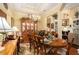 Elegant dining room featuring a chandelier, hardwood floors, and a large wooden table with seating at 3802 Abbott Ln # 14, Powder Springs, GA 30127
