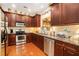 Spacious kitchen with stainless steel appliances, granite countertops, and ample cabinet space at 3802 Abbott Ln # 14, Powder Springs, GA 30127