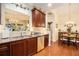 Well-appointed kitchen featuring granite countertops, cherry wood cabinets, and stainless steel appliances at 3802 Abbott Ln # 14, Powder Springs, GA 30127