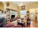Bright living room with vaulted ceiling, hardwood floors, and built-in bookshelves flanking a fireplace at 3802 Abbott Ln # 14, Powder Springs, GA 30127