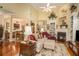 Bright living room with vaulted ceiling, hardwood floors, and built-in bookshelves flanking a fireplace at 3802 Abbott Ln # 14, Powder Springs, GA 30127