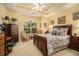 Tranquil bedroom with tray ceilings, a cozy rocking chair, and a sunny window at 3802 Abbott Ln # 14, Powder Springs, GA 30127