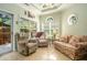 Bright sun room featuring tile floors, multiple windows, and comfortable seating, perfect for relaxation at 3802 Abbott Ln # 14, Powder Springs, GA 30127