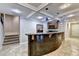 Finished basement bar area with tile flooring, granite countertops, and stainless steel refrigerator at 3871 River Mansion Dr, Peachtree Corners, GA 30096