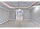 Finished basement with carpet flooring leads into another finished room at 3871 River Mansion Dr, Peachtree Corners, GA 30096