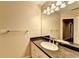 Bathroom featuring a large mirror, granite countertops, and modern lighting fixtures at 3871 River Mansion Dr, Peachtree Corners, GA 30096