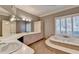 Large bathroom with double sinks, vanity and tub at 3871 River Mansion Dr, Peachtree Corners, GA 30096