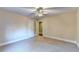 Bright bedroom with neutral paint, a ceiling fan, and hardwood floor in the doorway at 3871 River Mansion Dr, Peachtree Corners, GA 30096