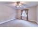 Bedroom featuring a ceiling fan, neutral paint, and natural light from the window at 3871 River Mansion Dr, Peachtree Corners, GA 30096