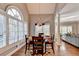 Formal dining room with large windows, natural light, and stylish chandelier at 3871 River Mansion Dr, Peachtree Corners, GA 30096