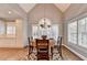 Vaulted dining room featuring chandelier, large window, and light hardwood floors at 3871 River Mansion Dr, Peachtree Corners, GA 30096