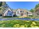 Inviting home boasts manicured lawn and long driveway for convenient parking at 3871 River Mansion Dr, Peachtree Corners, GA 30096