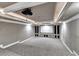 Home theater showcasing a projector screen, built-in cabinets, and door, plus carpeted floors at 3871 River Mansion Dr, Peachtree Corners, GA 30096