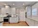Contemporary kitchen with stainless steel appliances, white cabinetry, and great natural light at 3871 River Mansion Dr, Peachtree Corners, GA 30096