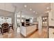 Open concept kitchen and dining area with a view of the living room fireplace at 3871 River Mansion Dr, Peachtree Corners, GA 30096