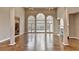 Bright living room with tall ceilings, fireplace, and large windows providing natural light at 3871 River Mansion Dr, Peachtree Corners, GA 30096