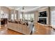 Cozy living room features hardwood floors, a fireplace, and ample seating, perfect for relaxing and entertaining at 3871 River Mansion Dr, Peachtree Corners, GA 30096