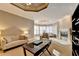 Bright living room with modern ceiling, fireplace, and large windows at 3871 River Mansion Dr, Peachtree Corners, GA 30096