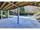 Relaxing covered patio area with view of the backyard and inground pool provides a private outdoor oasis at 3871 River Mansion Dr, Peachtree Corners, GA 30096