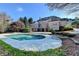 Scenic backyard featuring a sparkling pool, complemented by a spacious patio and views of the elegant home exterior at 3871 River Mansion Dr, Peachtree Corners, GA 30096