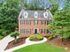 Charming brick two-story home showcasing manicured landscaping and a well-maintained front yard at 4250 Green Ridge Ne Dr, Marietta, GA 30062
