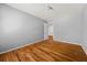 Clean, gray bedroom features hardwood floors and ample closet space at 2945 Cardinal Lake Cir, Duluth, GA 30096