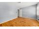 Cozy bedroom features hardwood floors and neutral walls at 2945 Cardinal Lake Cir, Duluth, GA 30096