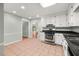 Open concept kitchen with stainless steel oven and a view of the home's entryway at 2945 Cardinal Lake Cir, Duluth, GA 30096