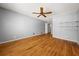 Light-filled main bedroom with hardwood floors, ceiling fan, and ensuite access at 2945 Cardinal Lake Cir, Duluth, GA 30096