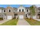 Inviting townhome exteriors showcase brick facades, single-car garages, and well-maintained landscaping at 349 Navigator Ln, Mcdonough, GA 30253