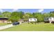 Charming single-Gathering home featuring a spacious front yard and mature trees in a serene neighborhood at 4218 Carlos Ct, Powder Springs, GA 30127