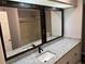 Bathroom with granite countertops, dual mirrors, and a shower/tub combo, creating a serene space at 6353 Wedgeview Ct, Tucker, GA 30084
