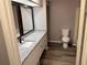 Bathroom featuring granite countertops, a modern sink, and essential fixtures in a cozy space at 6353 Wedgeview Ct, Tucker, GA 30084