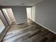Spacious bedroom with wood-look flooring and ample natural light, offering a comfortable retreat at 6353 Wedgeview Ct, Tucker, GA 30084