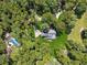 An overhead view shows the house is surrounded by mature trees with a long driveway at 4200 E 166 Hwy, Carrollton, GA 30116