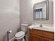 A half bathroom featuring a framed mirror, modern sink and faucet and neutral wall paint at 4200 E 166 Hwy, Carrollton, GA 30116
