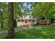 Beautiful brick home with covered porch, lush lawn, and mature trees at 4200 E 166 Hwy, Carrollton, GA 30116