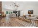 Open concept living room with stone fireplace, vaulted ceilings, modern kitchen, and great natural light at 4200 E 166 Hwy, Carrollton, GA 30116