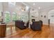Bright living room with hardwood floors, fireplace, and large windows at 4200 E 166 Hwy, Carrollton, GA 30116