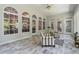 Sunroom boasting tiled floors, white trim, and large windows offering views of the outdoors at 4200 E 166 Hwy, Carrollton, GA 30116