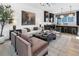 Bright and airy living room featuring stylish modern furniture, sleek hardwood floors, and open access to the kitchen at 950 Hughley Cir # 100, Atlanta, GA 30316