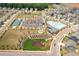 Aerial view of community amenities including a pool, clubhouse, and sports courts at 1150 Buice Lake Pkwy, Acworth, GA 30102