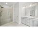Bathroom featuring a glass enclosed shower, double vanity, and modern fixtures at 1150 Buice Lake Pkwy, Acworth, GA 30102