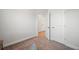 Cozy bedroom with carpet and open doorway to hallway at 1150 Buice Lake Pkwy, Acworth, GA 30102